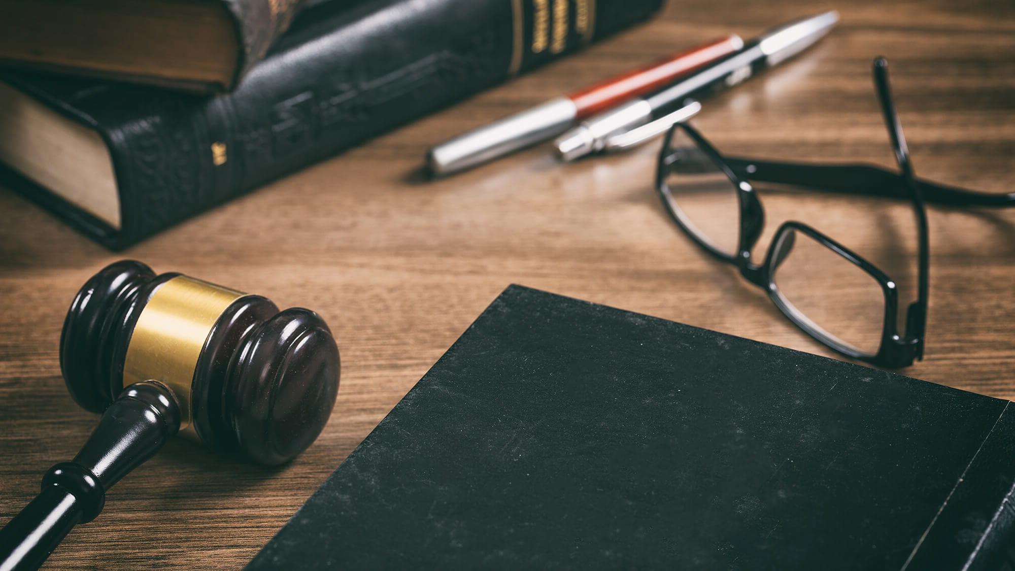 gavel, book and glasses